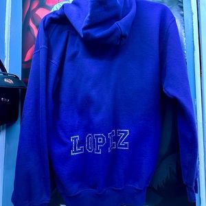Purple Paw Print hoodie with “Lopez” bling on the back.